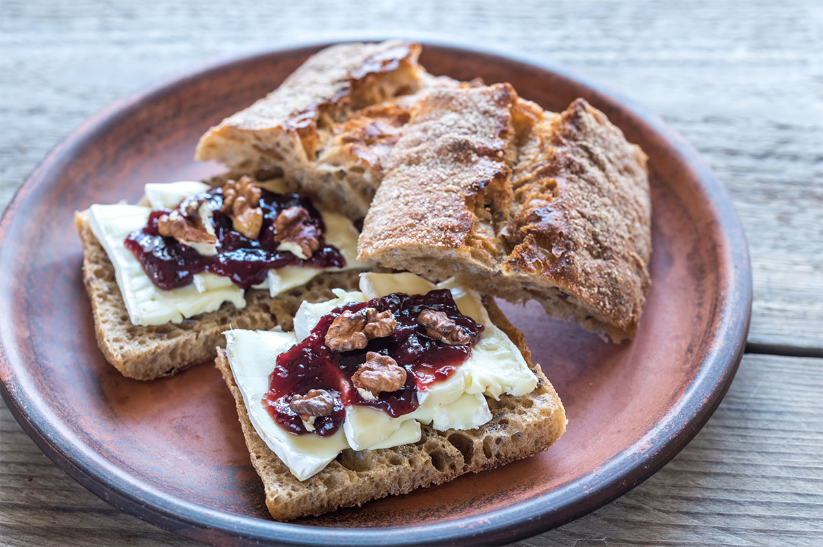 Two toasts with brie and jam on a plate | Girl Meets Food