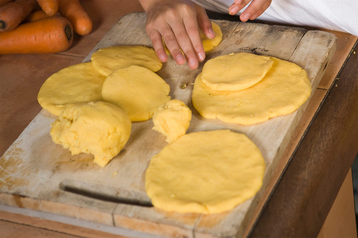A person is making some pancakes from a masa dough | Girl Meets Food