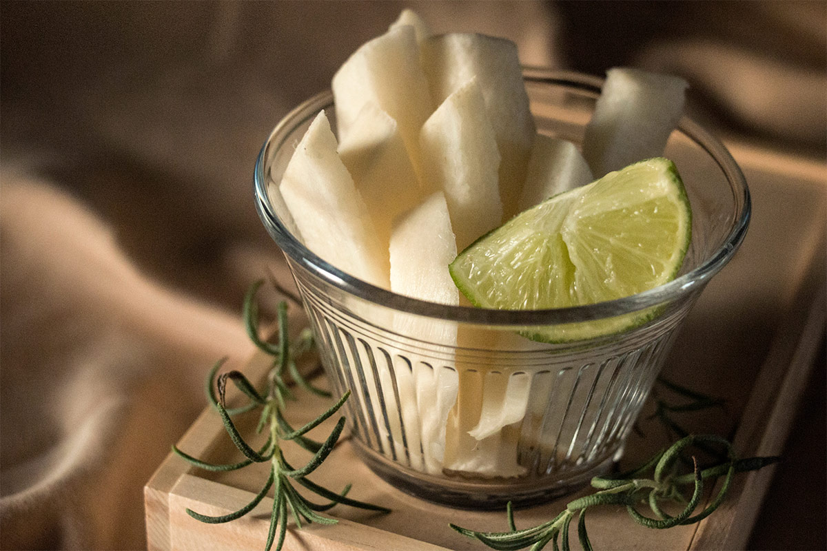 Jicama slices and lime wedges are in a transparent small bowl | Girl Meets Food