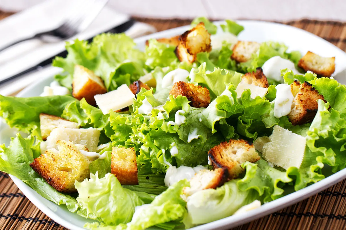 A plate of Caesar salad | Girl Meets Food