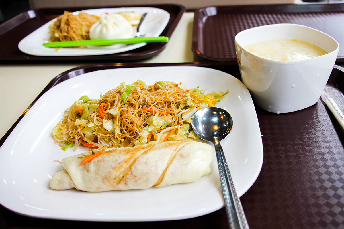 Chow Mein served with rolls and soup on a black table | Girl Meets Food