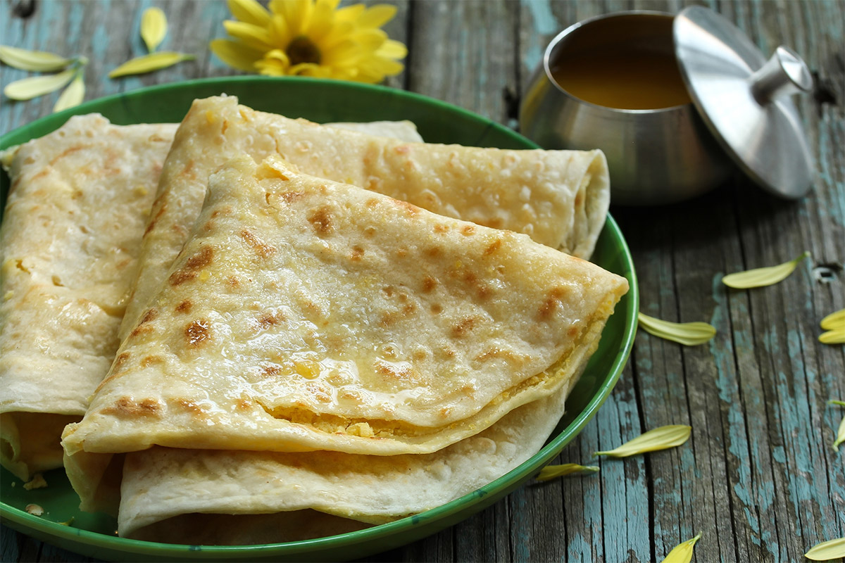 Obbattu on a green plate that is on a wooden surface | Girl Meets Food