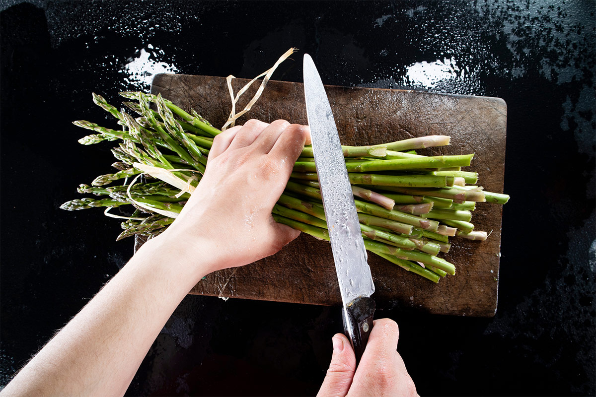 A person is preparing asparagus | Girl Meets Food