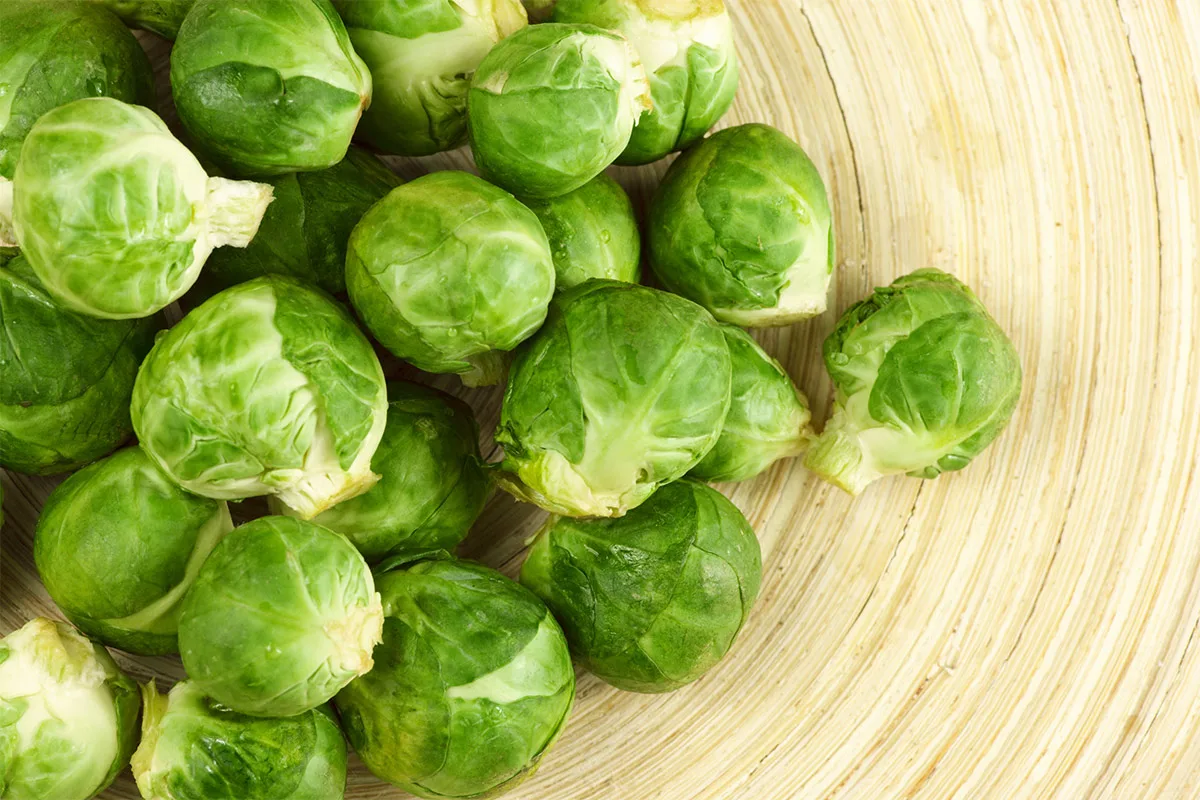 Fresh Brussels sprouts in a bowl | Girl Meets Food