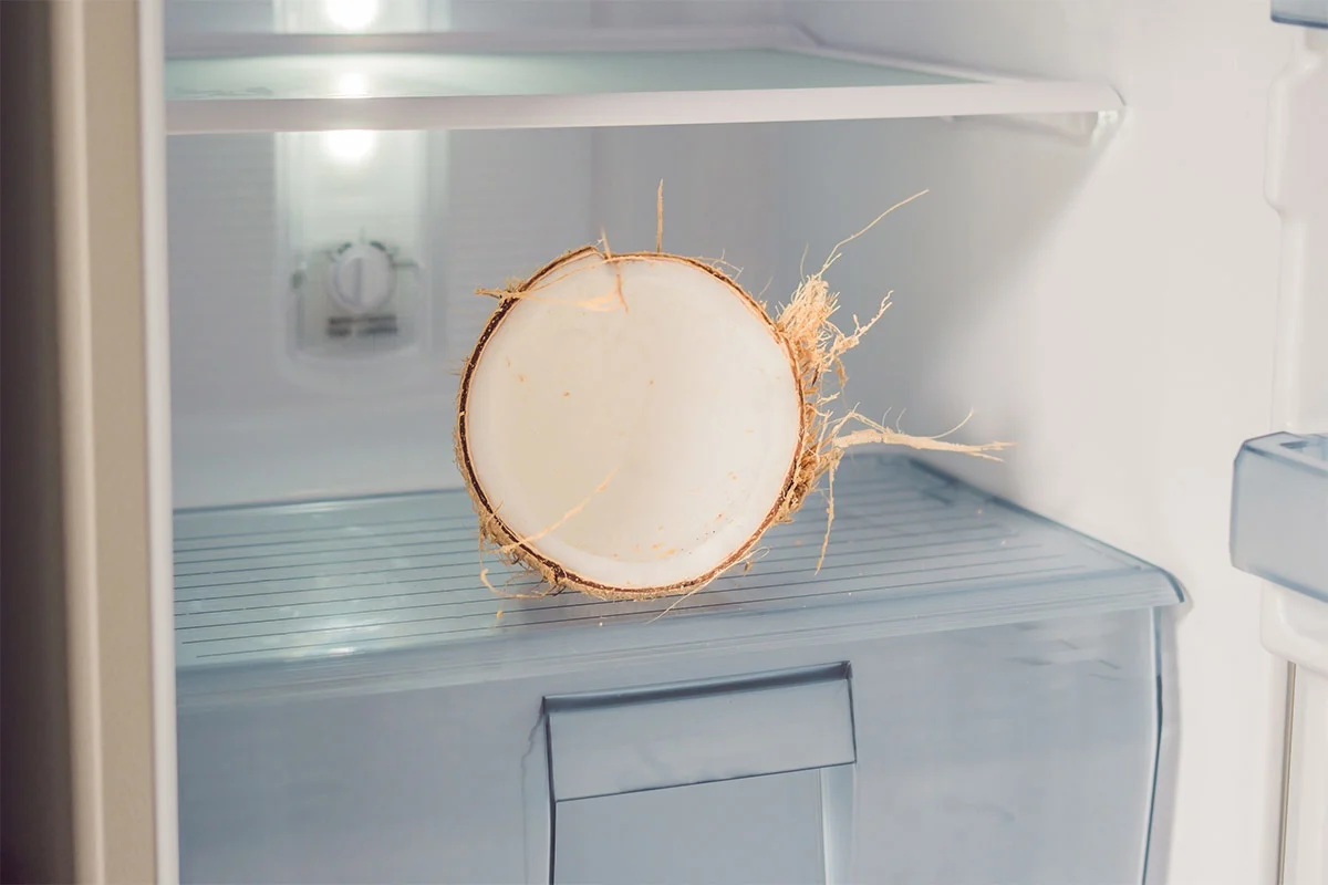 Coconut half in the fridge | Girl Meets Food