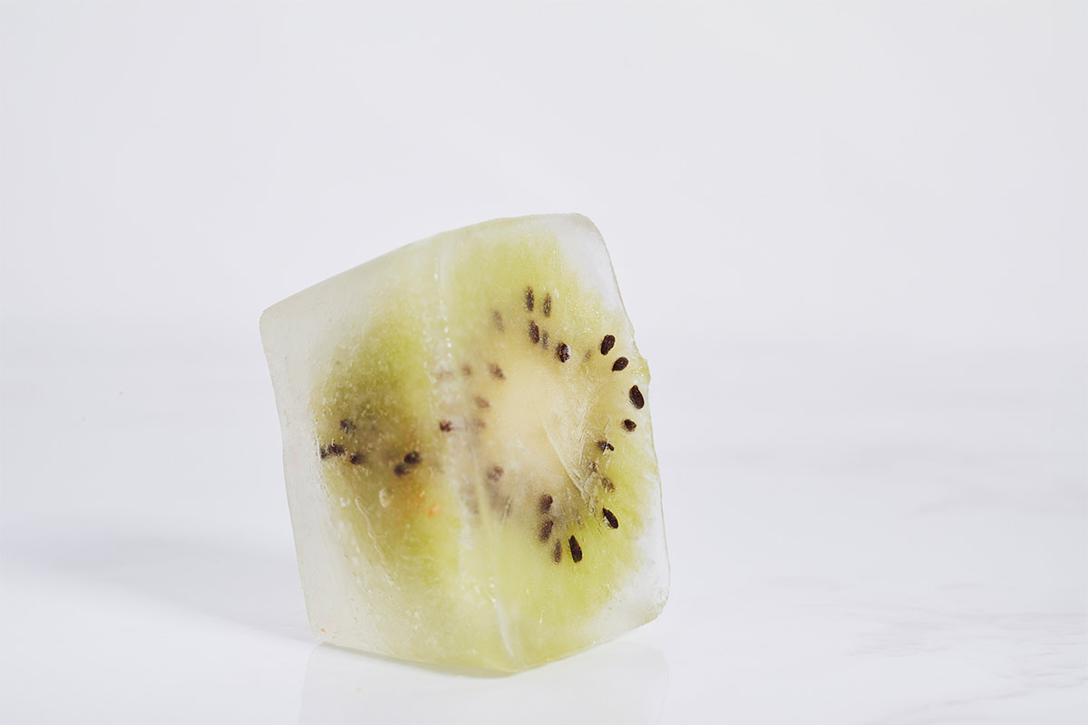 Frozen kiwi cube on grey surface | Girl Meets Food