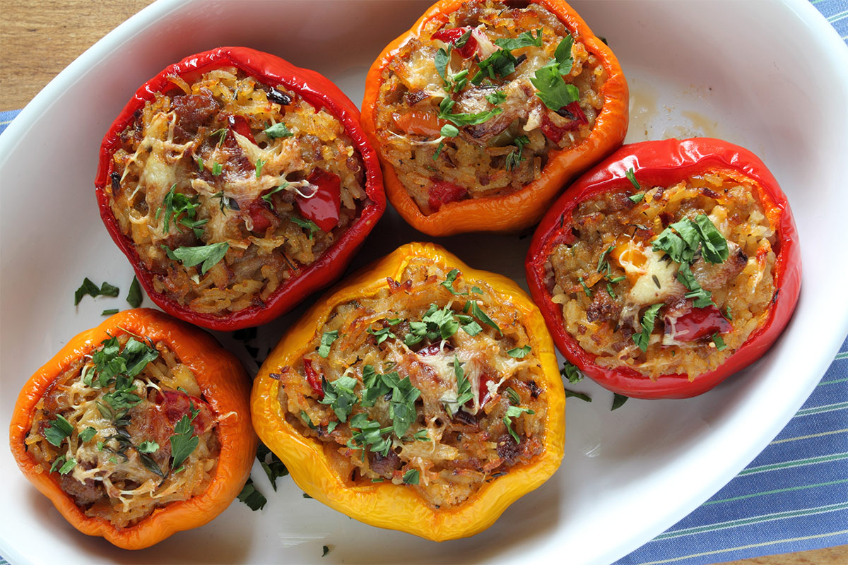 Five stuffed peppers in a bowl | Girl Meets Food