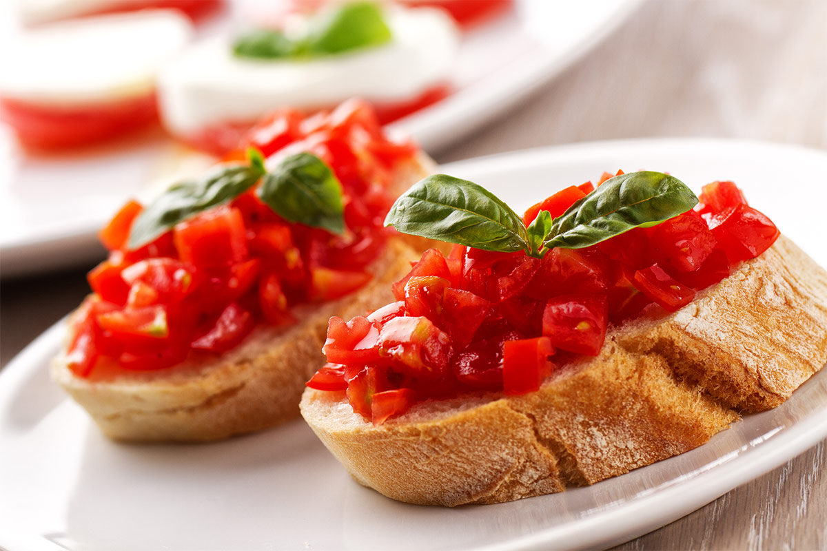 Tomato Bruschetta on a plate | Girl Meets Food
