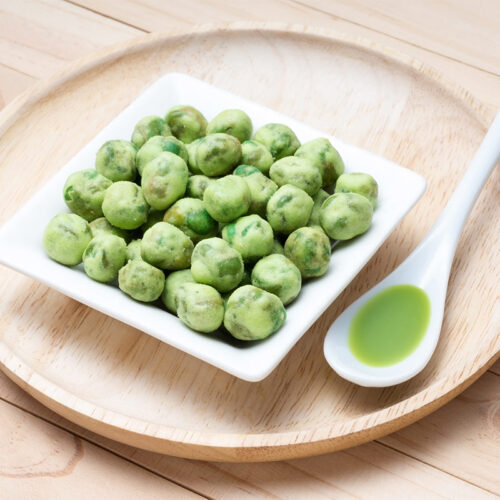 Wasabi peas served on wooden plate | Girl Meets Food