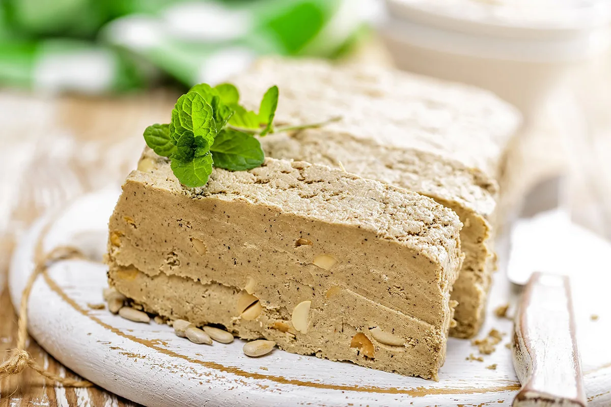 Tahan halva slices on a white cutting board | Girl Meets Food