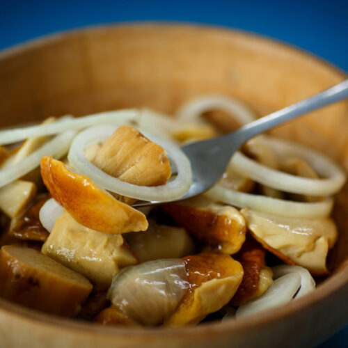 Wooden bowl of marinated mushrooms | Girl Meets Food