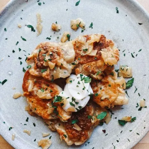 A plate of Vegan Pierogi With Potato and Caramelized Onion | Girl Meets Food