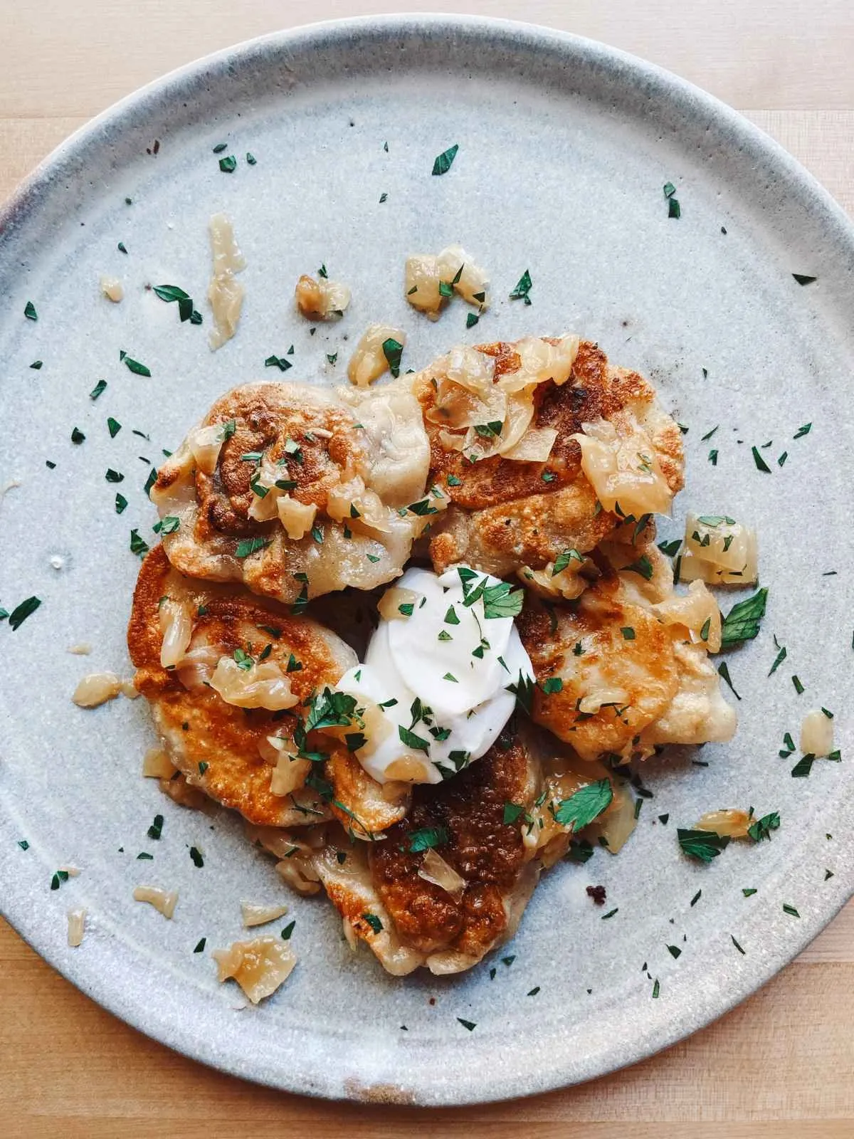 A plate of Vegan Pierogi With Potato and Caramelized Onion | Girl Meets Food