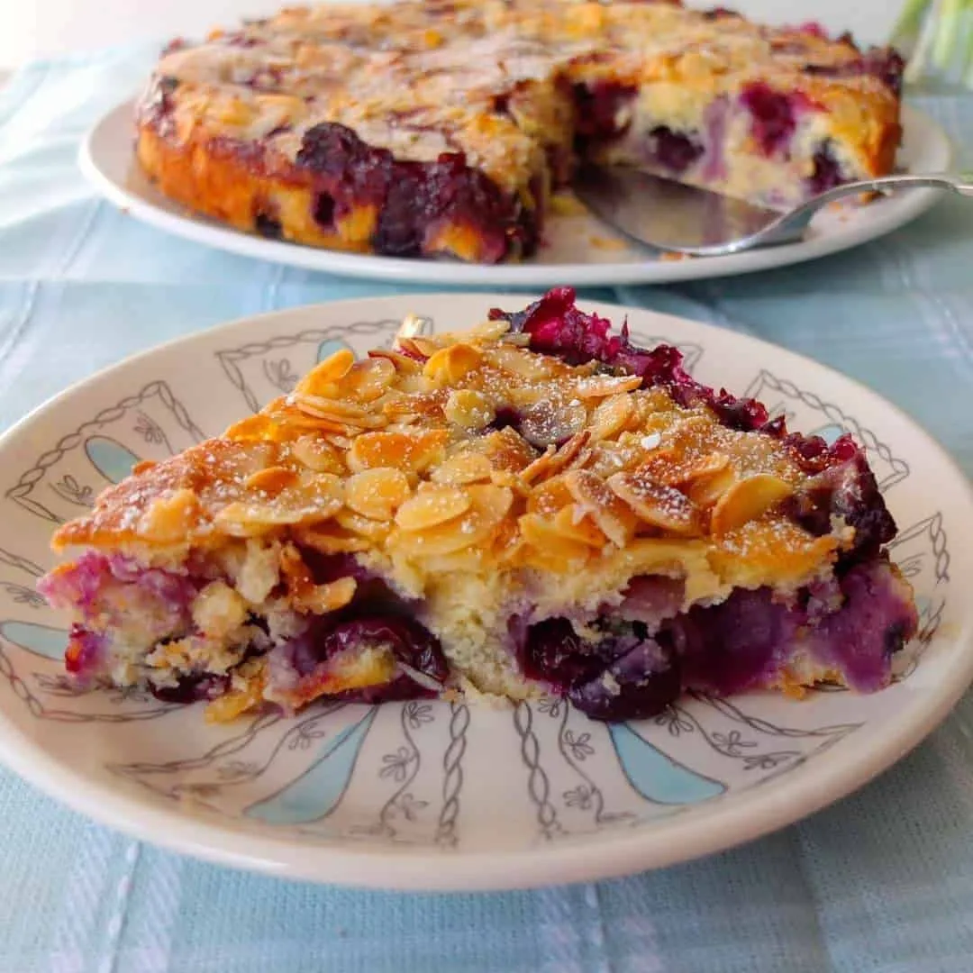 A piece of Blueberry Almond Cake on the plate | Girl Meets Food