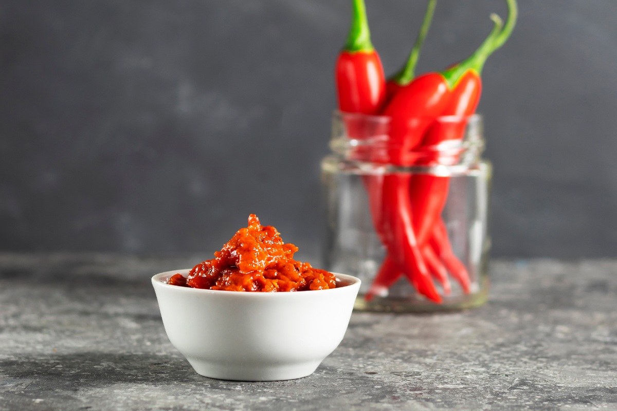 A bowl Lyutenitsa spread on a marble surface | Girl Meets Food